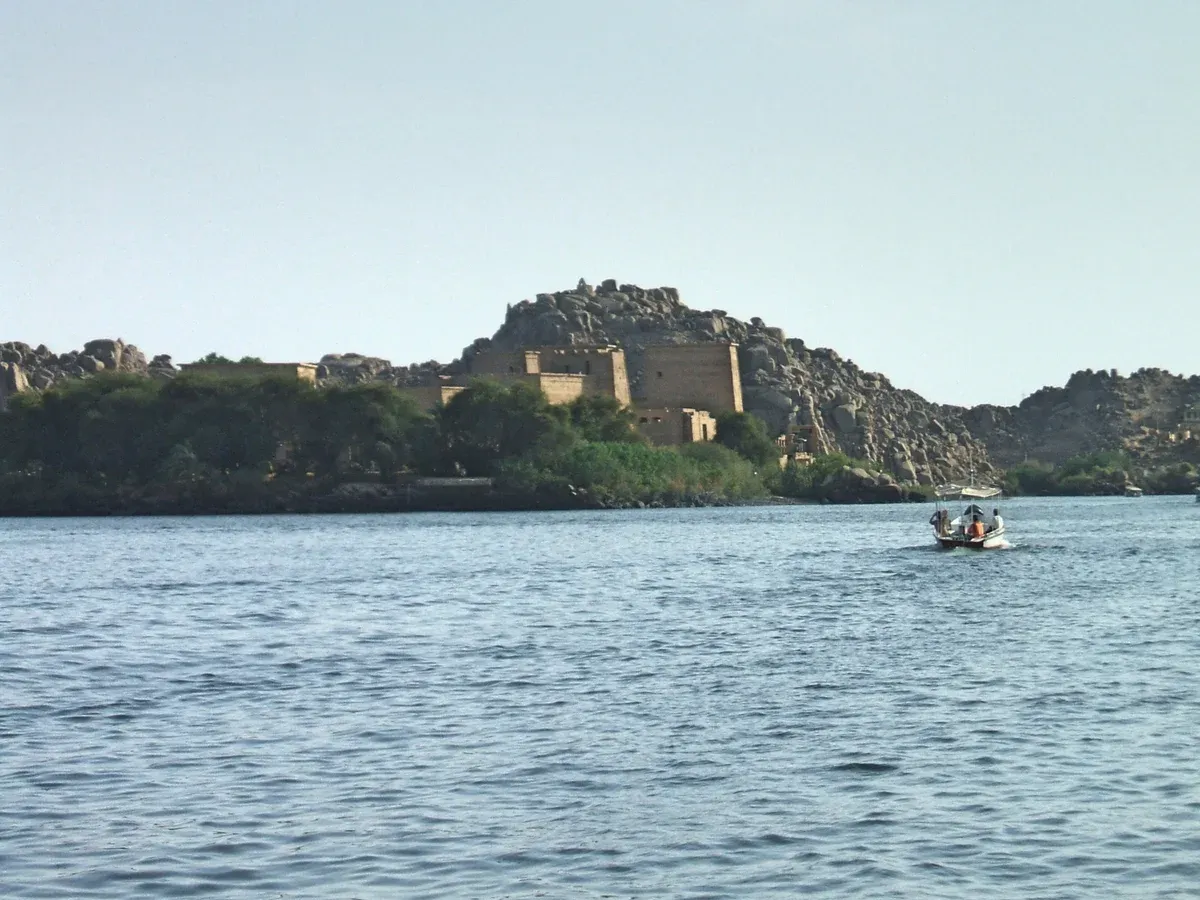 Philae Temple on its island seen from the water on a Nile river cruise from Aswan