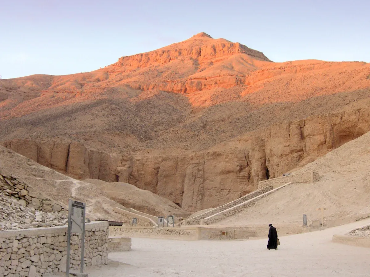 The sunlit limestone hills above the Valley of the Kings on the Luxor West Bank, a stop on a Nile river cruise